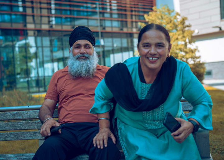 The couple, leaning in and laughing