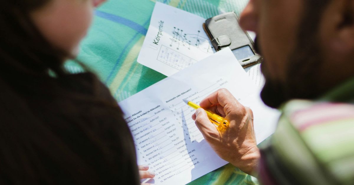 A person helping another to learn a language.