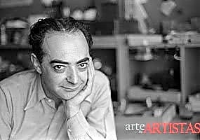 Fotografia em preto e branco de Brassaï em Paris, capturando a cidade noturna com ruas iluminadas e sombras profundas.