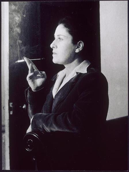 Dora Maar with a cigarette holder by Brassaï, 1944