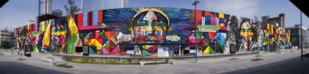 Biografia de Eduardo Kobra - MURAL ETNIAS – Todos Somos Um (Povos nativos dos cinco continentes) – Eduardo Kobra. 2016: Para marcar as olimpíadas que foram sediadas no Brasil em 2016, Kobra realiza o mural intitulado  “Todos Somos Um” (Povos nativos dos cinco continentes). Localizado na área portuária do Rio de Janeiro, no conhecido centro do Boulevard Olímpico. Esse incrível trabalho, é reconhecido como o maior grafite do mundo