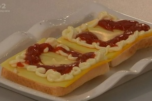 Drab sandwichs open with mayo and ketchup squirted on them