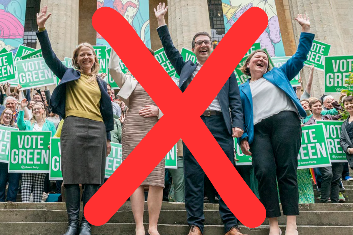 The four Green Party MPs lined up facing the camera smiling and waving, with a big red cross drawn over the photo