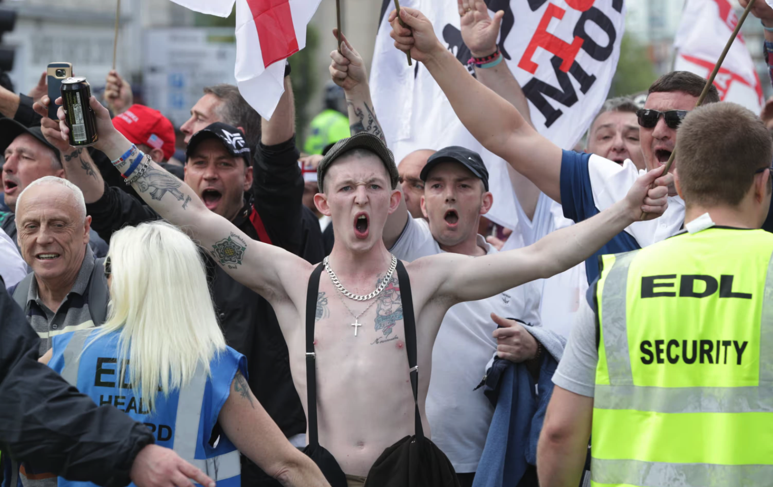 EDL thugs cheer and shout in the street. Photograph: Joel Goodman/LNP/REX/Shutterstock