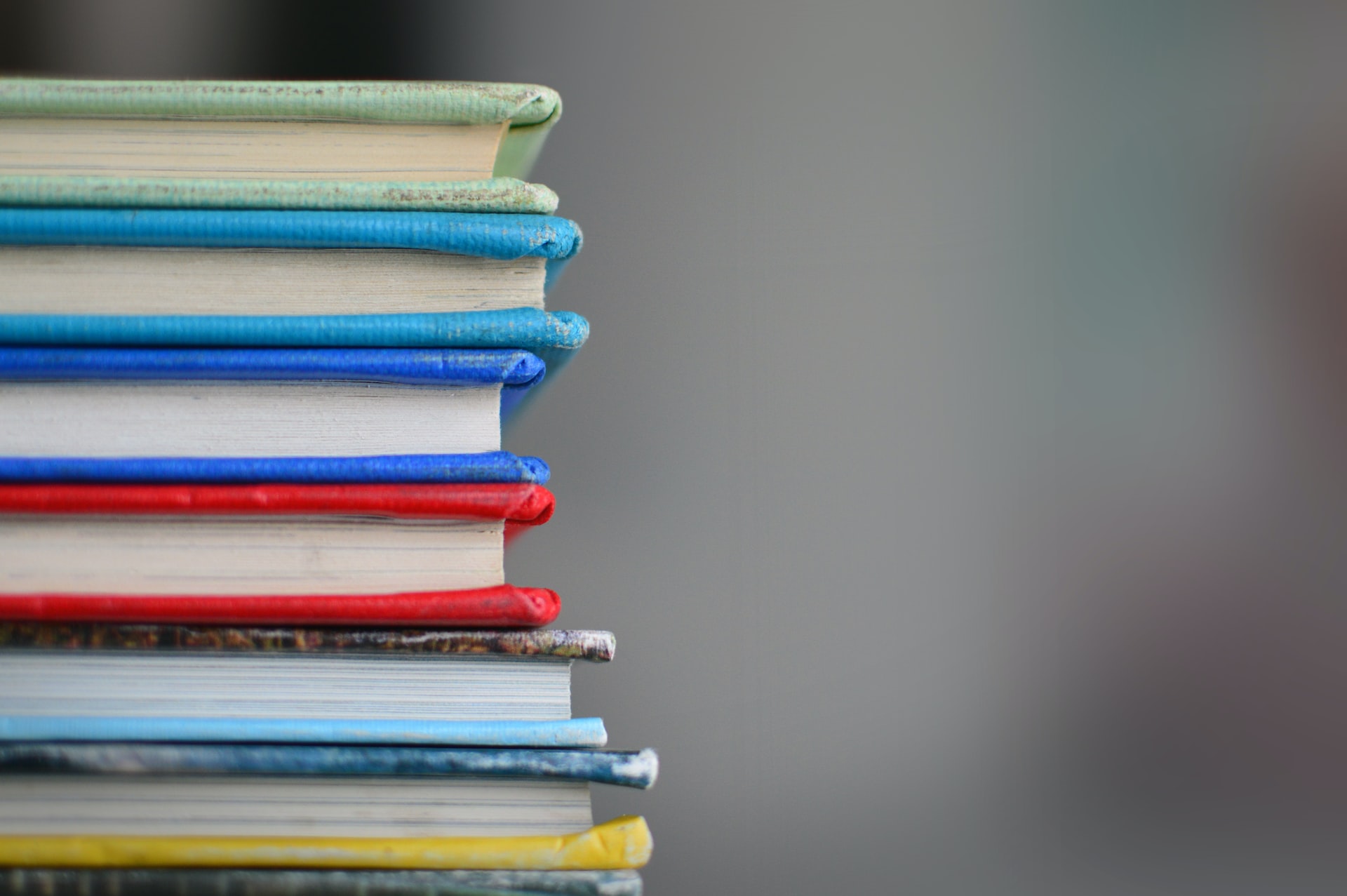 books with different colored covers stacked