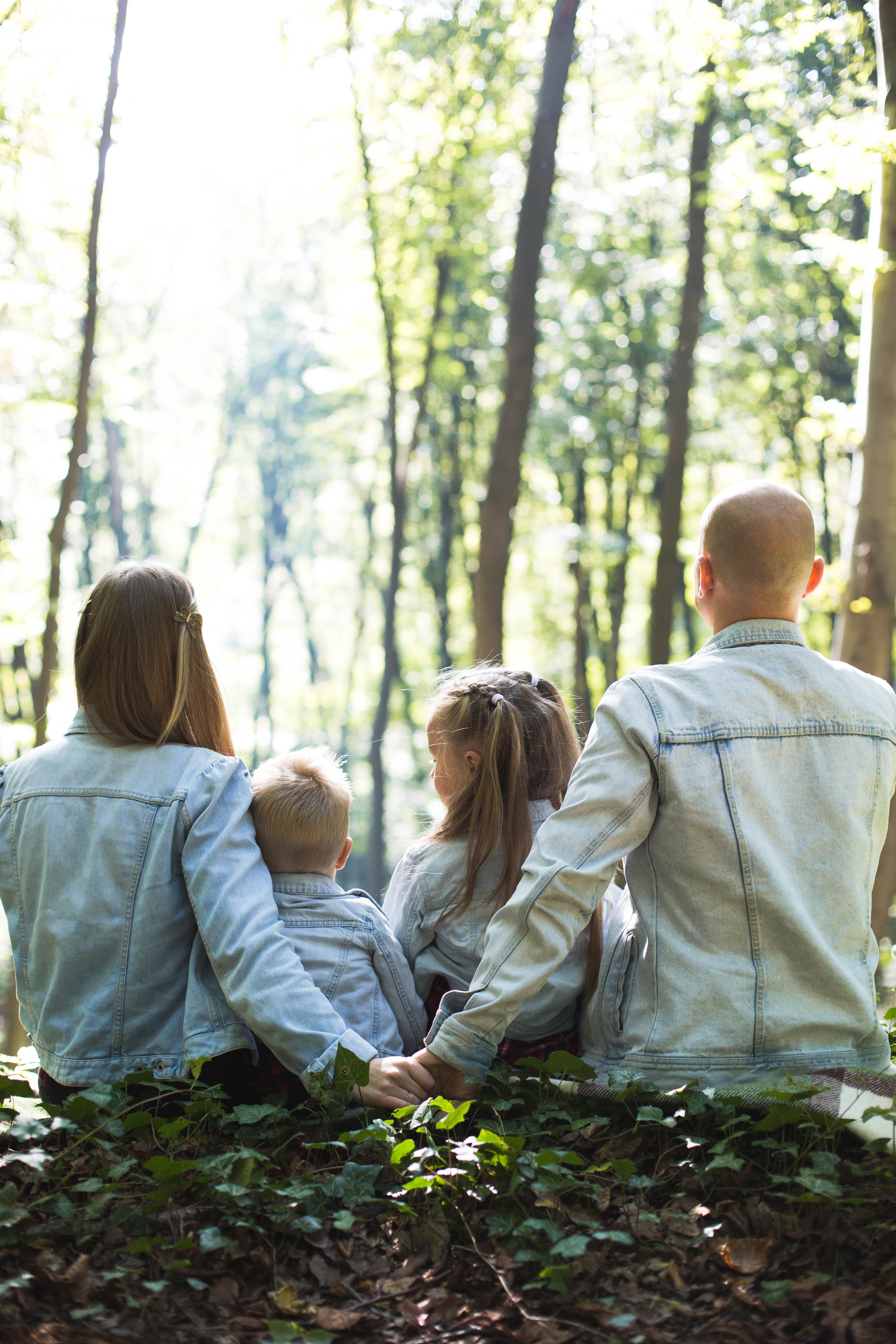 family of four with their backs turned