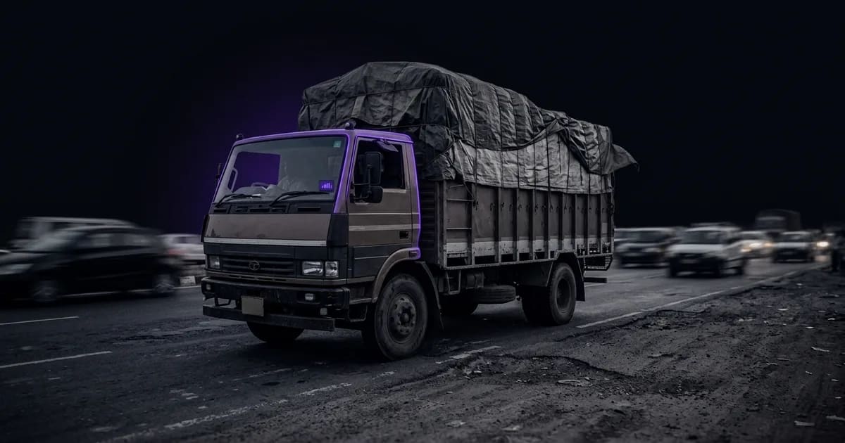 An AI dashcam showing ADAS and DMS alerts for an Indian truck navigating chaotic highway traffic.