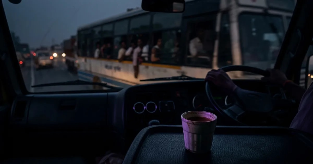 A truck driver at night looking tired, with an AI dashcam interface overlay showing a drowsiness alert