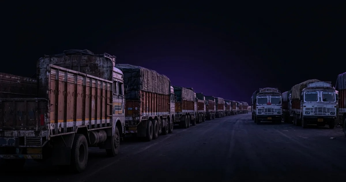 A truck stopped at an Indian RTO check post at dusk, illustrating the topic of how to avoid vehicle detention