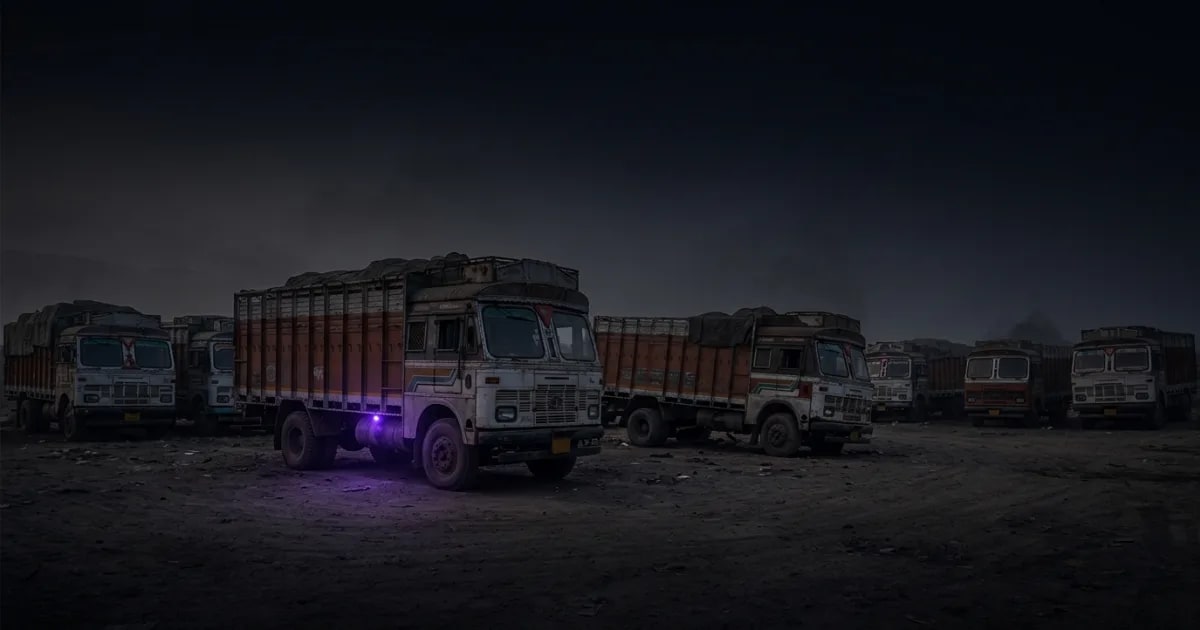 A small fleet of Indian trucks parked at a depot, representing the target audience for fleet management software