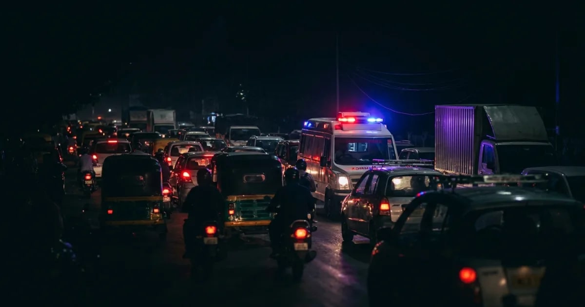 An Indian ambulance with a MoboSafe GPS tracker overlay, navigating through city traffic