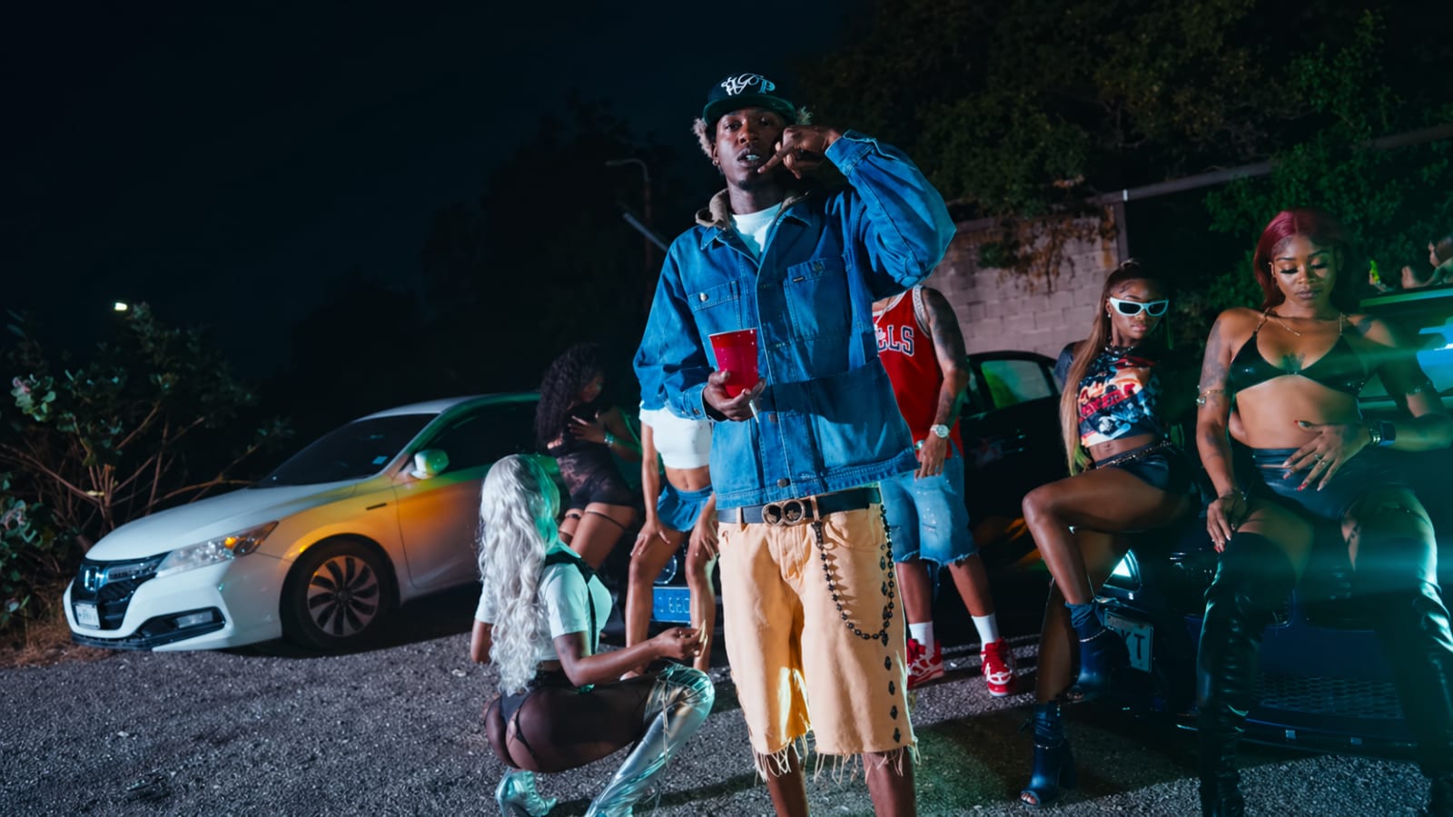 Skillibeng surrounded by street-level dancehall energy