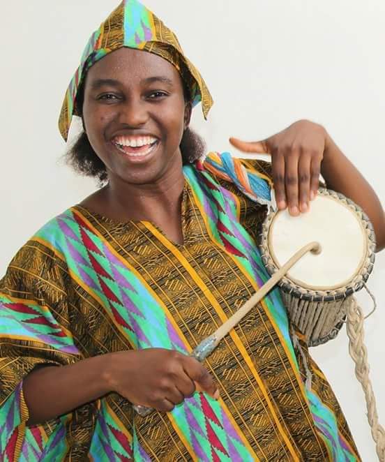 Ronke Aluko performing with talking drum