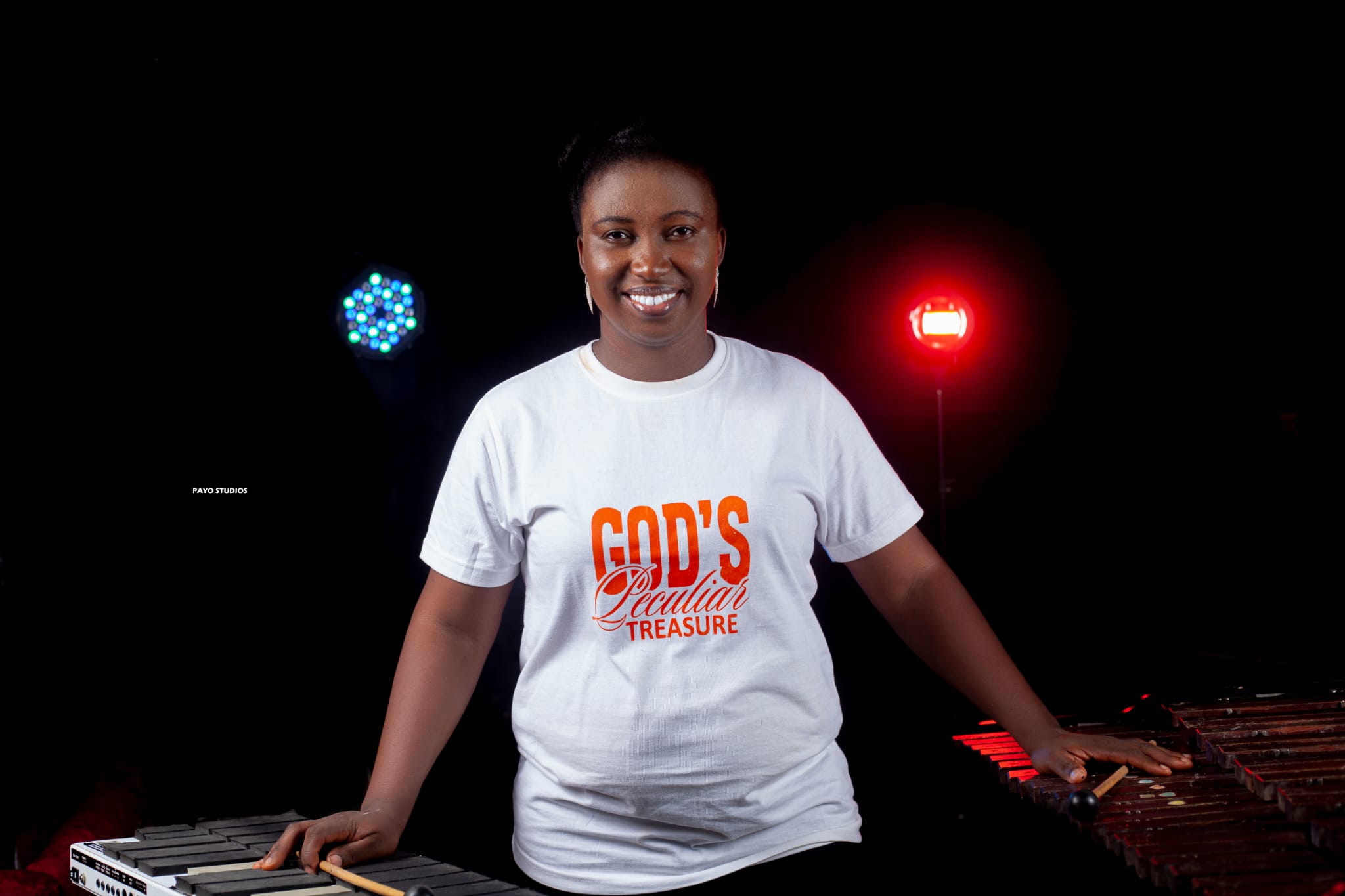 Ronke Aluko playing talking drum