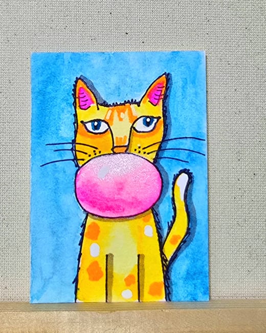 Ginger Cat Blows A Bubble