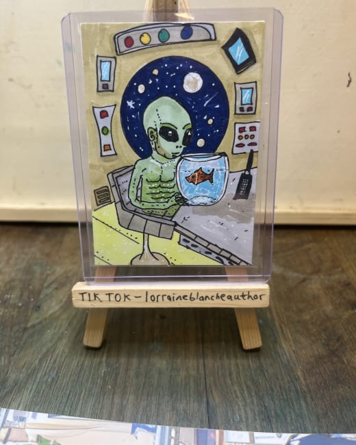 Alien and his pet goldfish