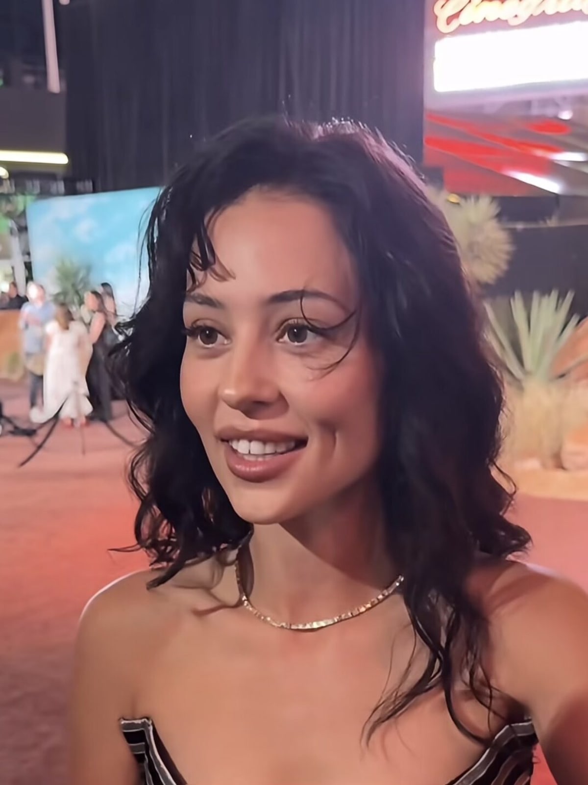 Alexa Demie smiling and talking to fans at a Euphoria premiere event in 2026