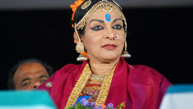Dancer Mallika Sarabhai in classical Kuchipudi costume with gold jewellery and a bindi