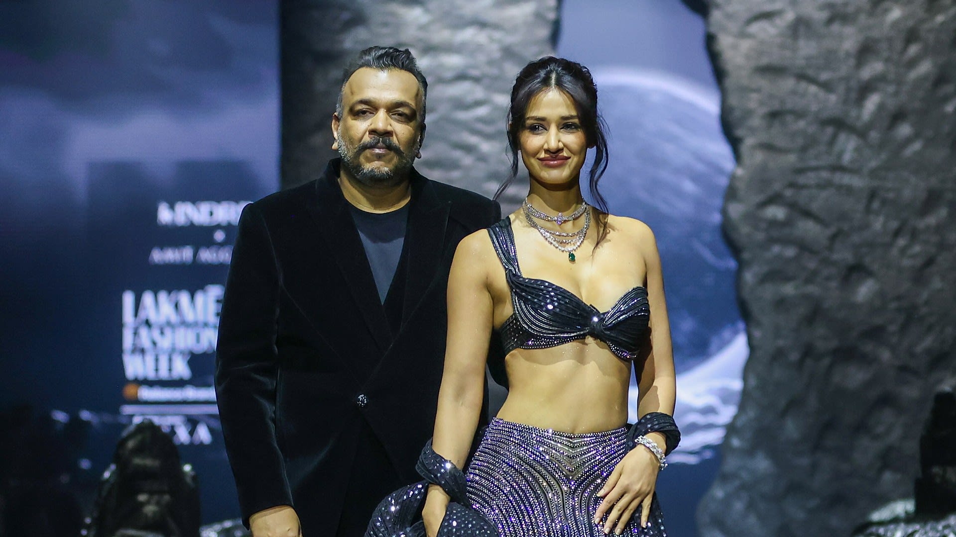 Designer Amit Aggarwal and Disha Patani in a bejewelled mermaid lehenga taking the runway bow at Lakmé Fashion Week x FDCI, March 2026