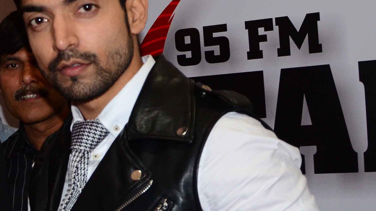 Actor Gurmeet Choudhary in a black vest at a radio event