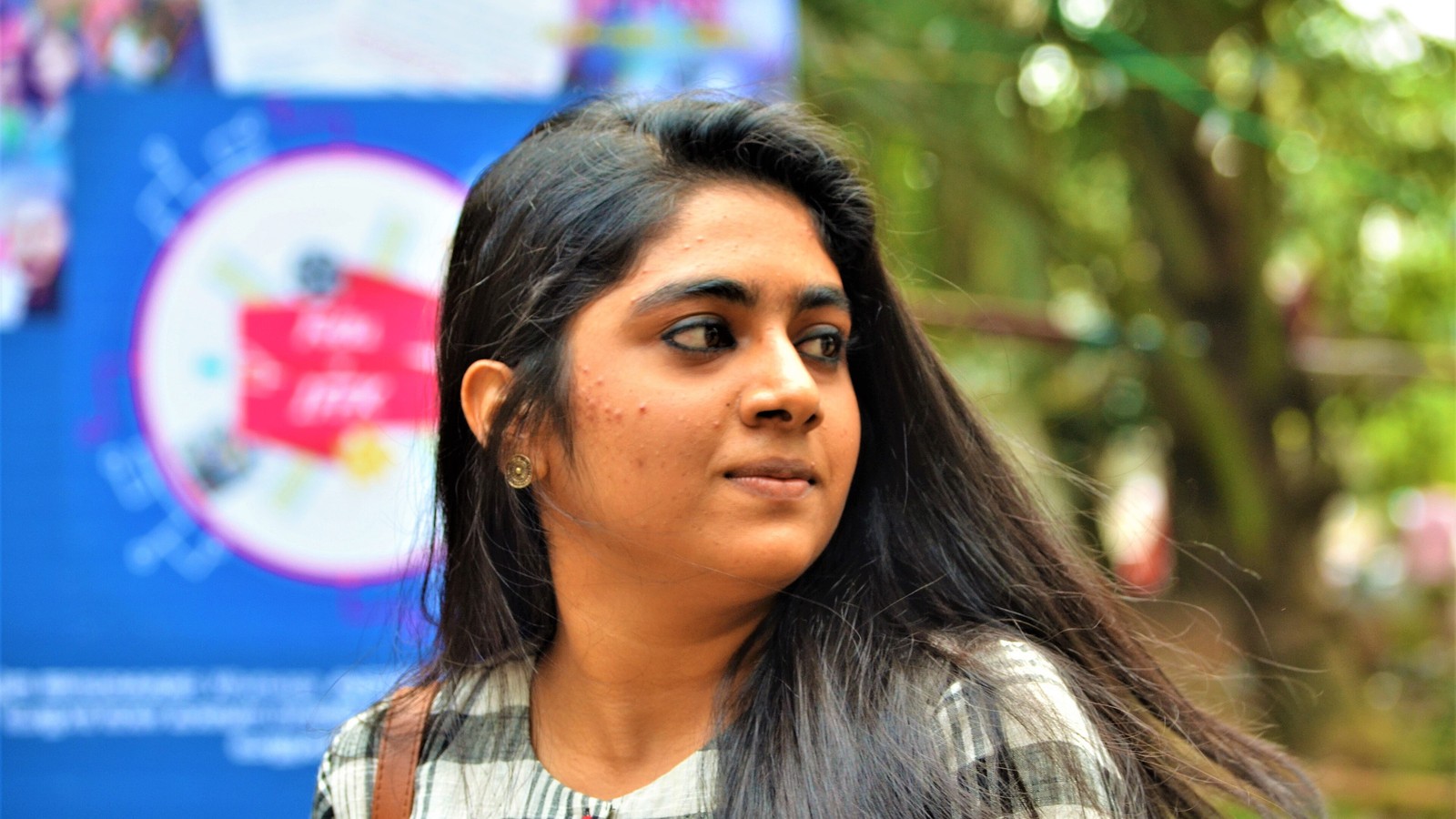 Actress Nimisha Sajayan smiling in a portrait