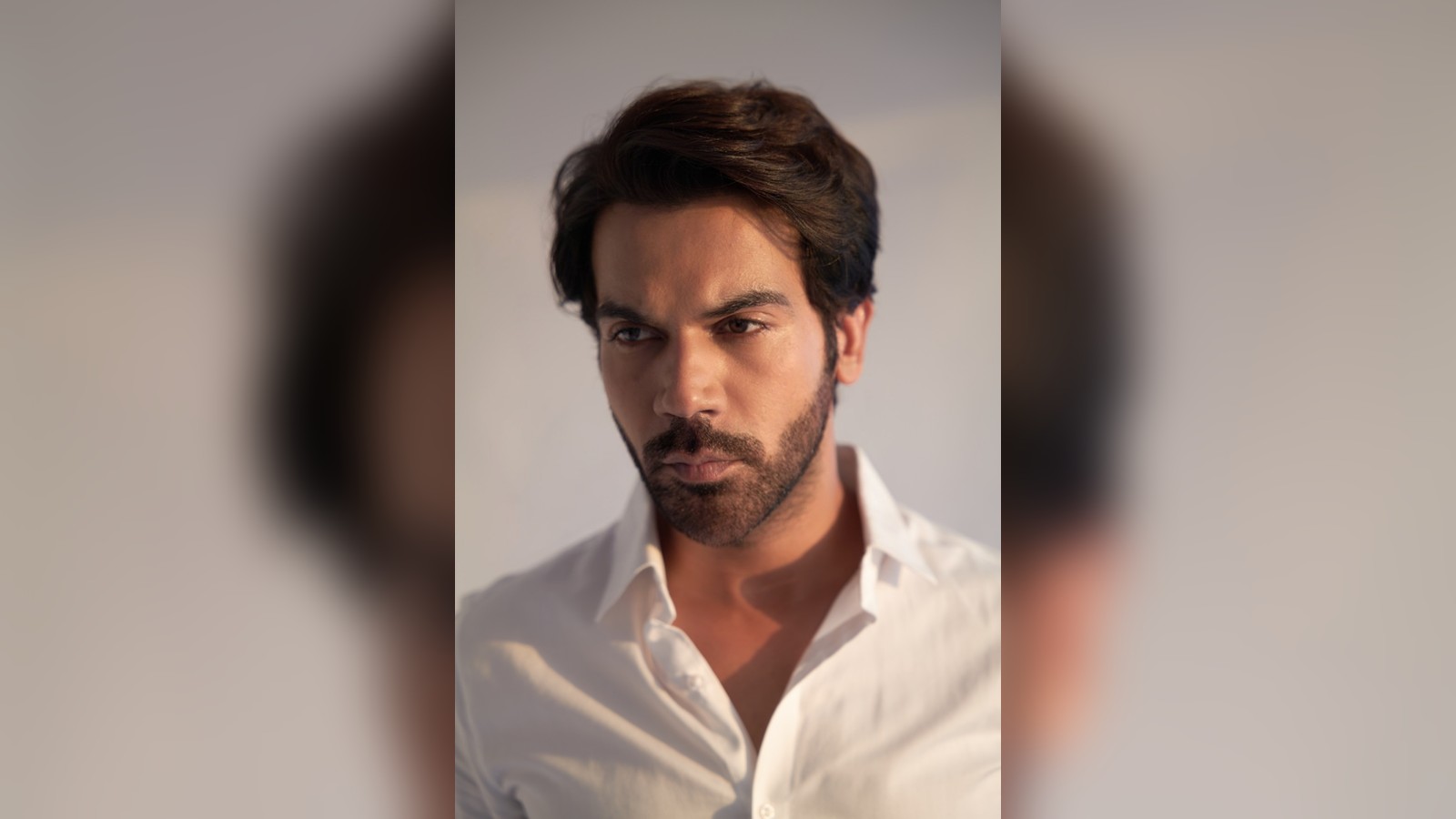 Actor Rajkummar Rao in a portrait wearing a white shirt