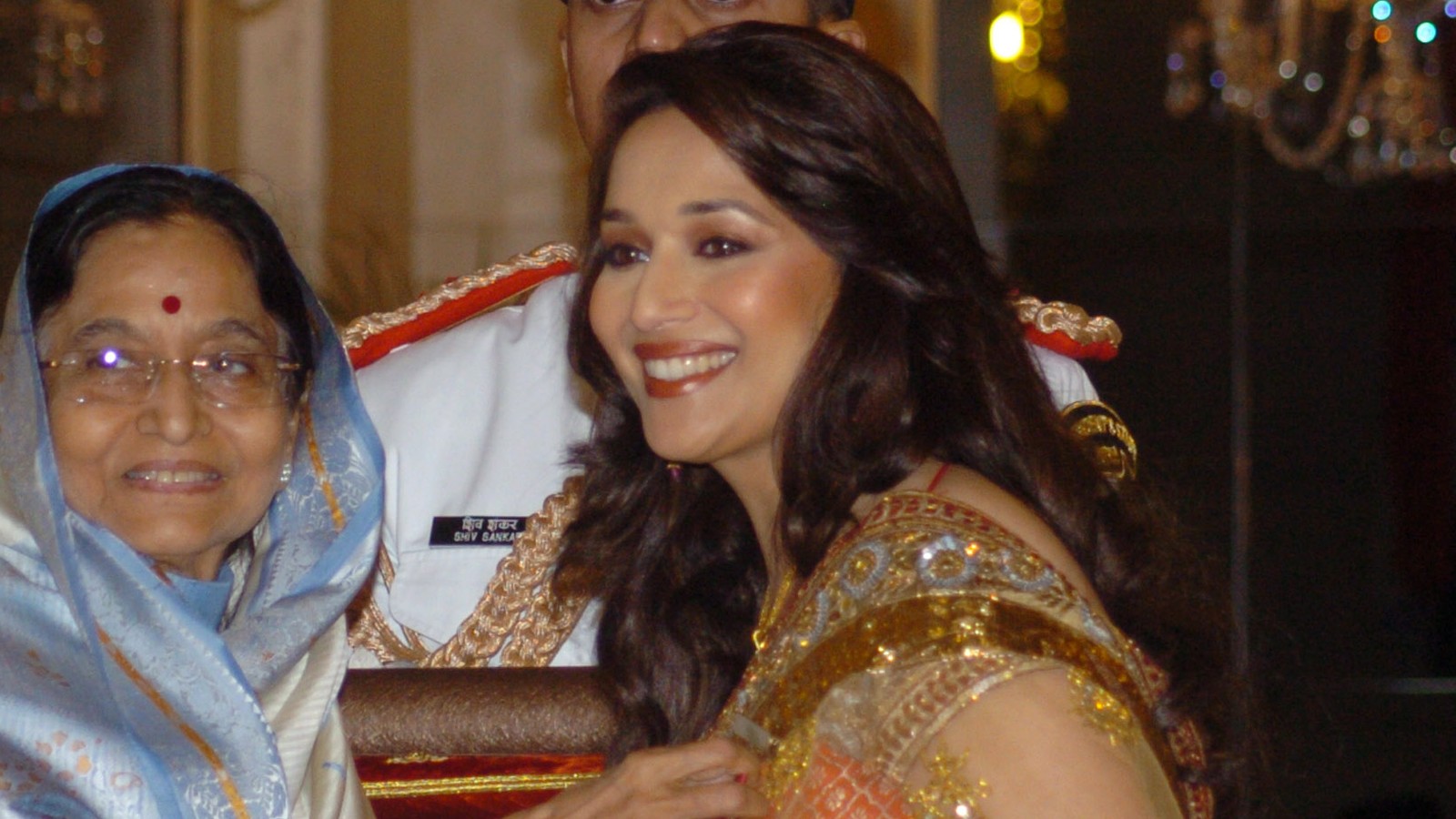 Madhuri Dixit receiving the Padma Shri from the President of India