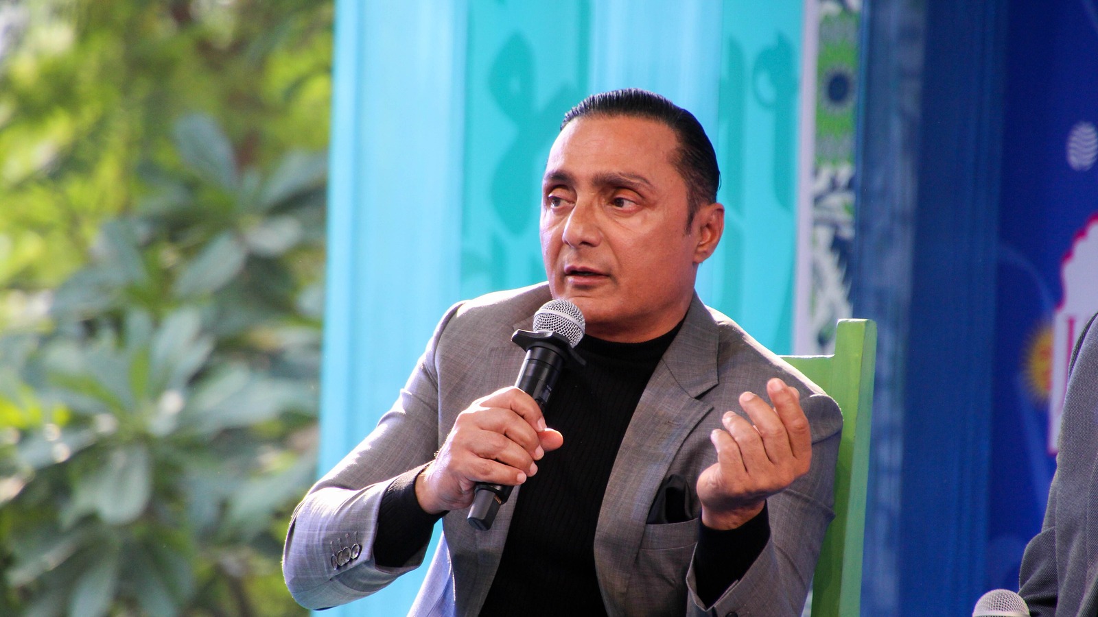 Actor Rahul Bose speaking into a microphone at the 2025 Jaipur Literature Festival