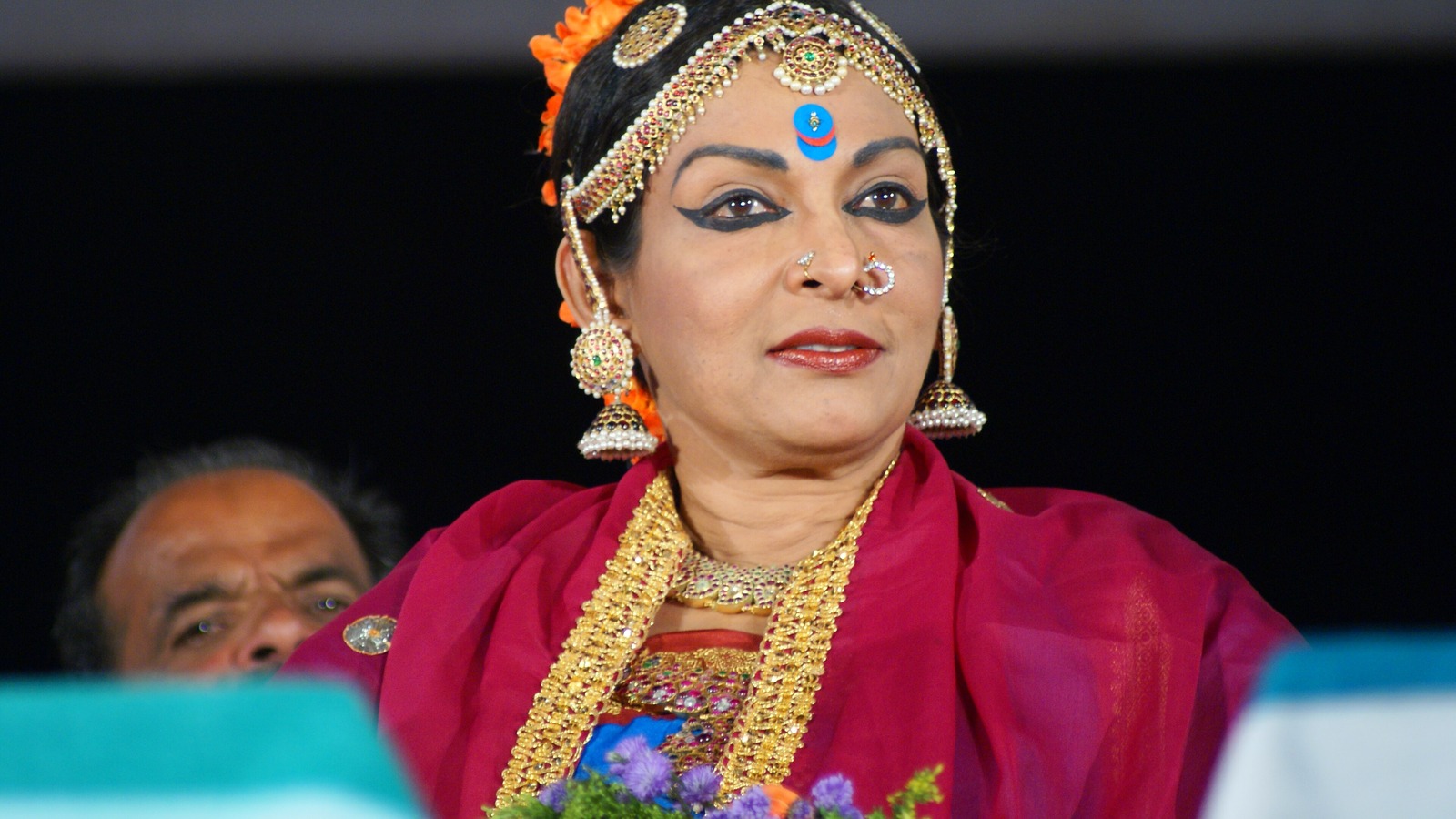 Dancer Mallika Sarabhai in classical Kuchipudi costume with gold jewellery and a bindi