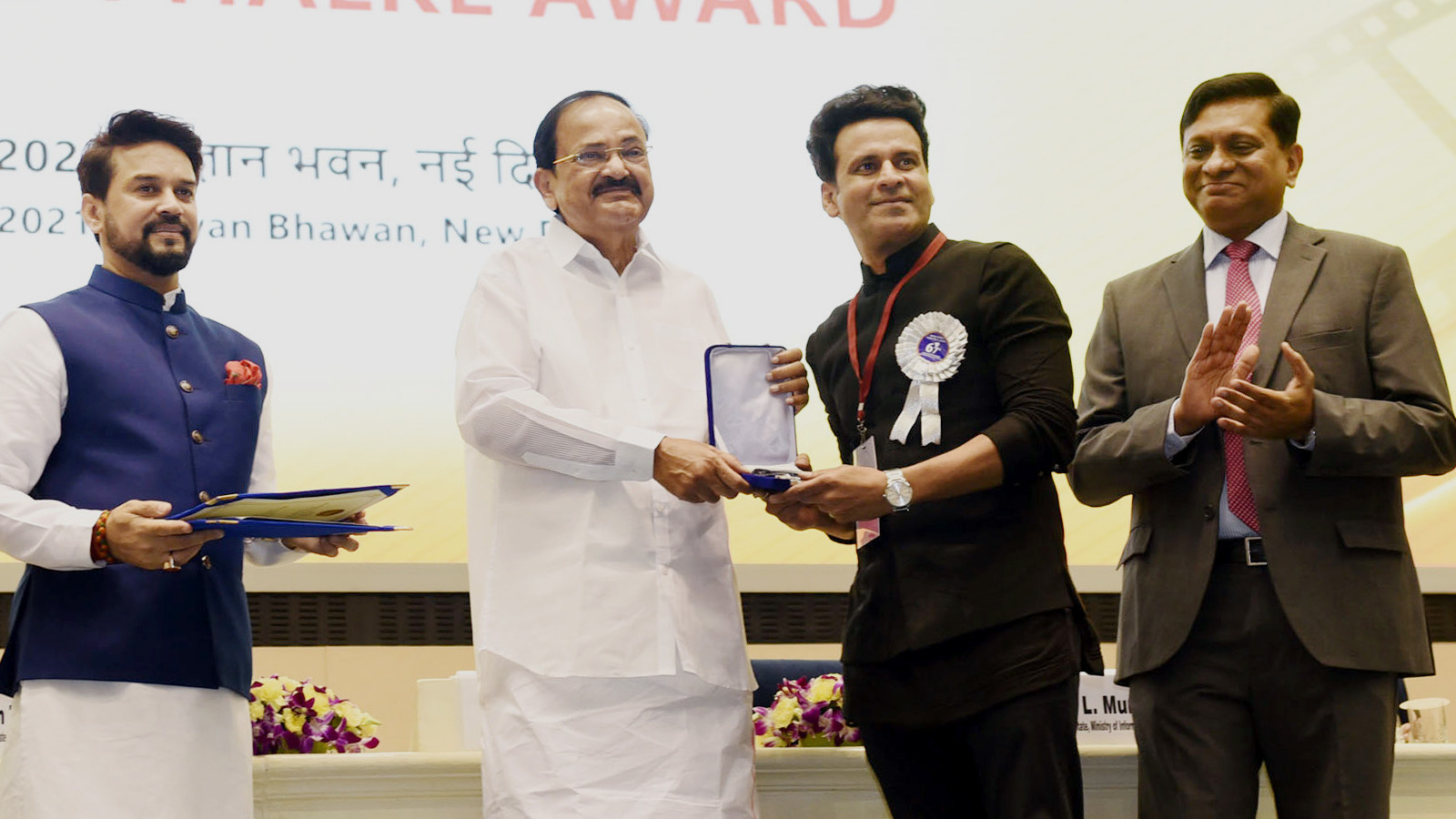 Manoj Bajpayee receiving a National Film Award from Vice President M. Venkaiah Naidu at a ceremony in New Delhi in 2021