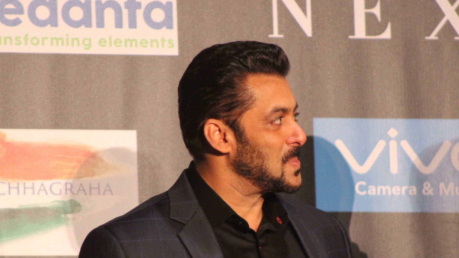 Salman Khan in profile wearing a dark checked blazer and black shirt at the IIFA 2017 press conference in New York