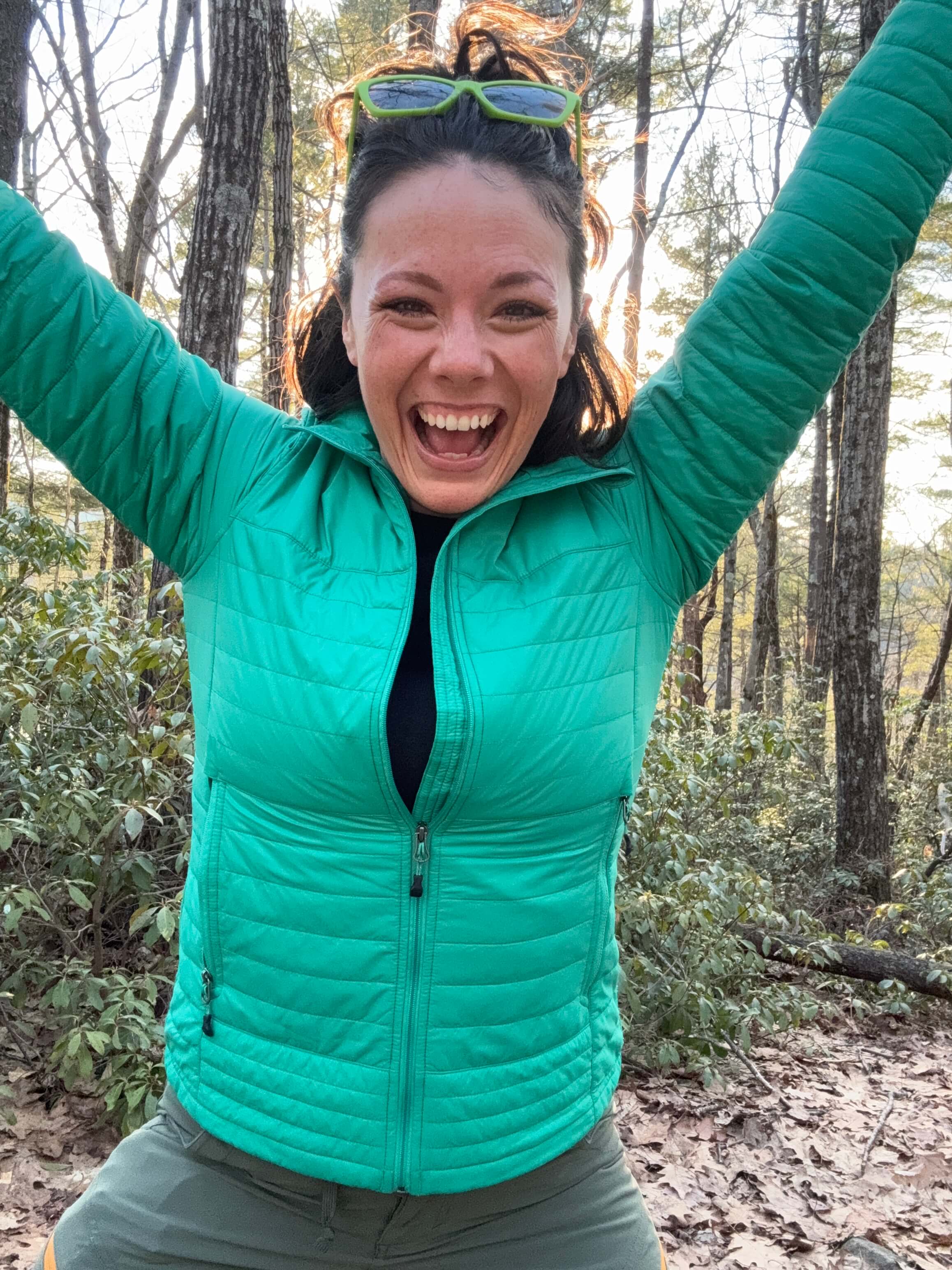 Grace Mahoney arms up in the woods