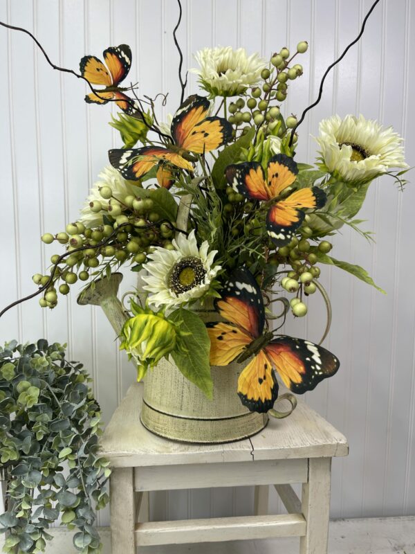 watering can flower arrangement