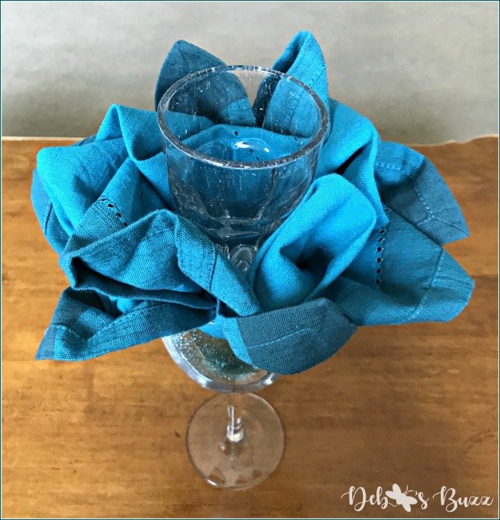napkin rose in glass