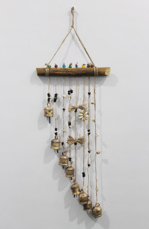 rustic wind chime hanging in garden