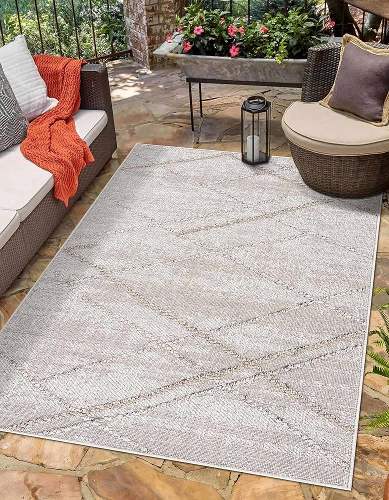 layered outdoor rug wicker furniture porch