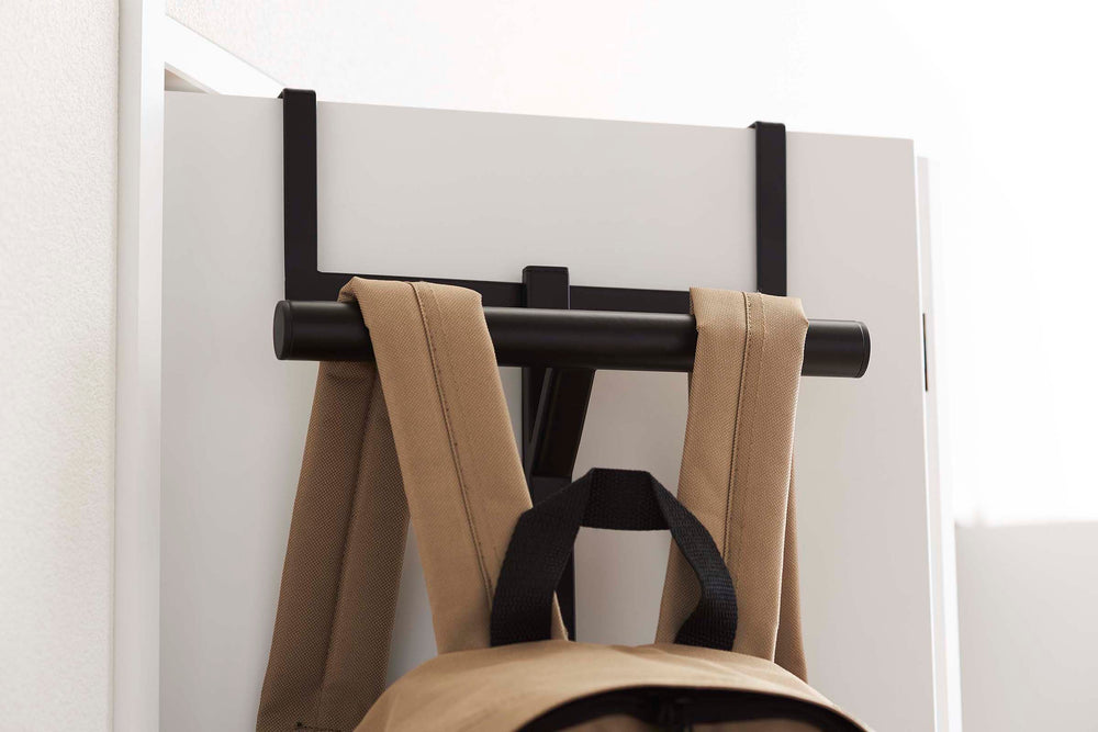 over door metal hooks holding backpacks entryway organization
