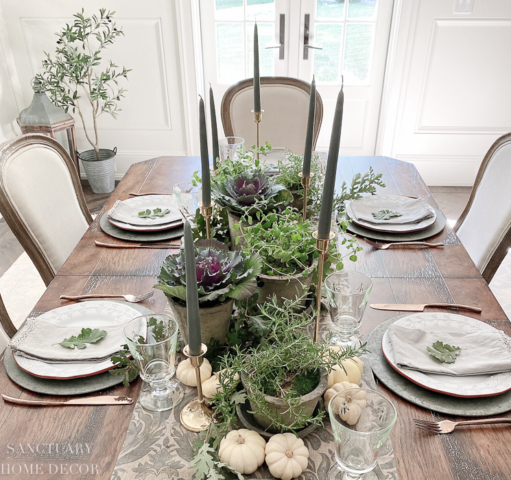 herb pots on outdoor dining table centerpiece