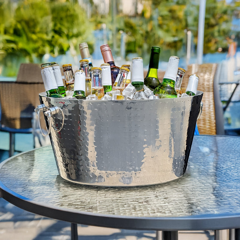 galvanized metal bucket with ice and bottles on patio table outdoor dining area decor
