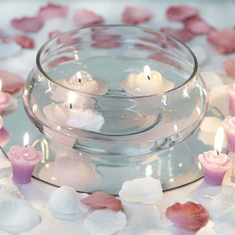 glass bowl with floating candles on dining table
