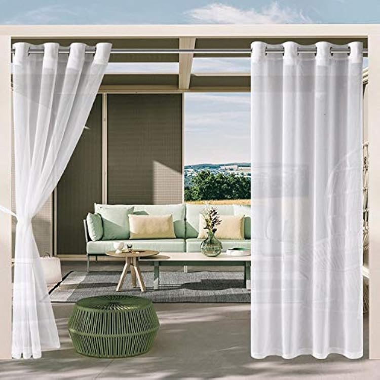 sheer white curtains on outdoor pergola dining area