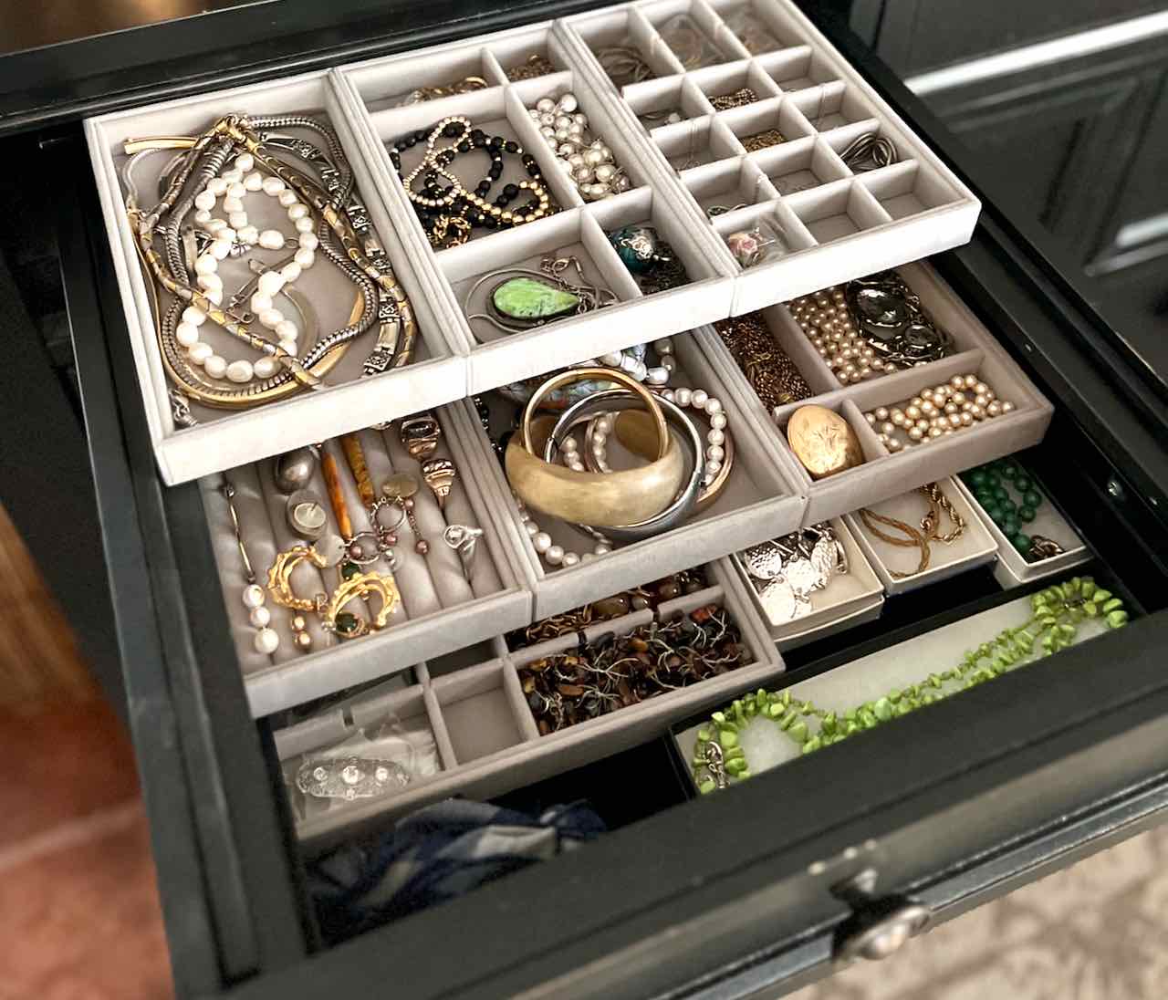 drawer turned jewelry organizer with hooks and compartments