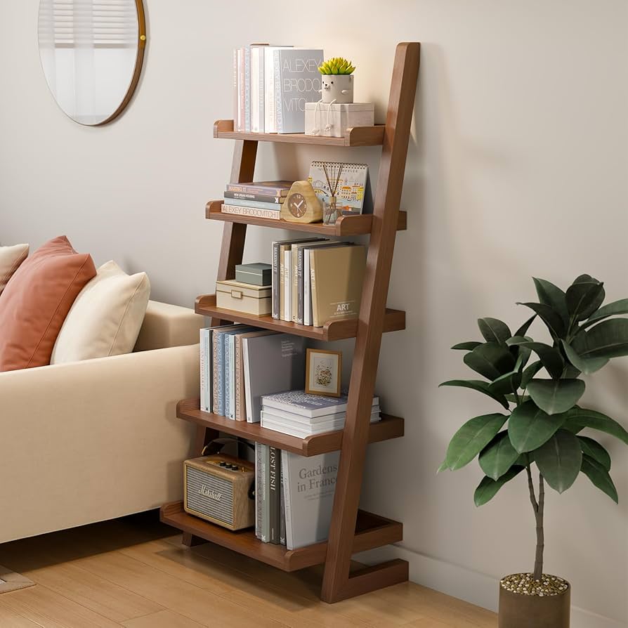 wooden ladder bookshelf with books