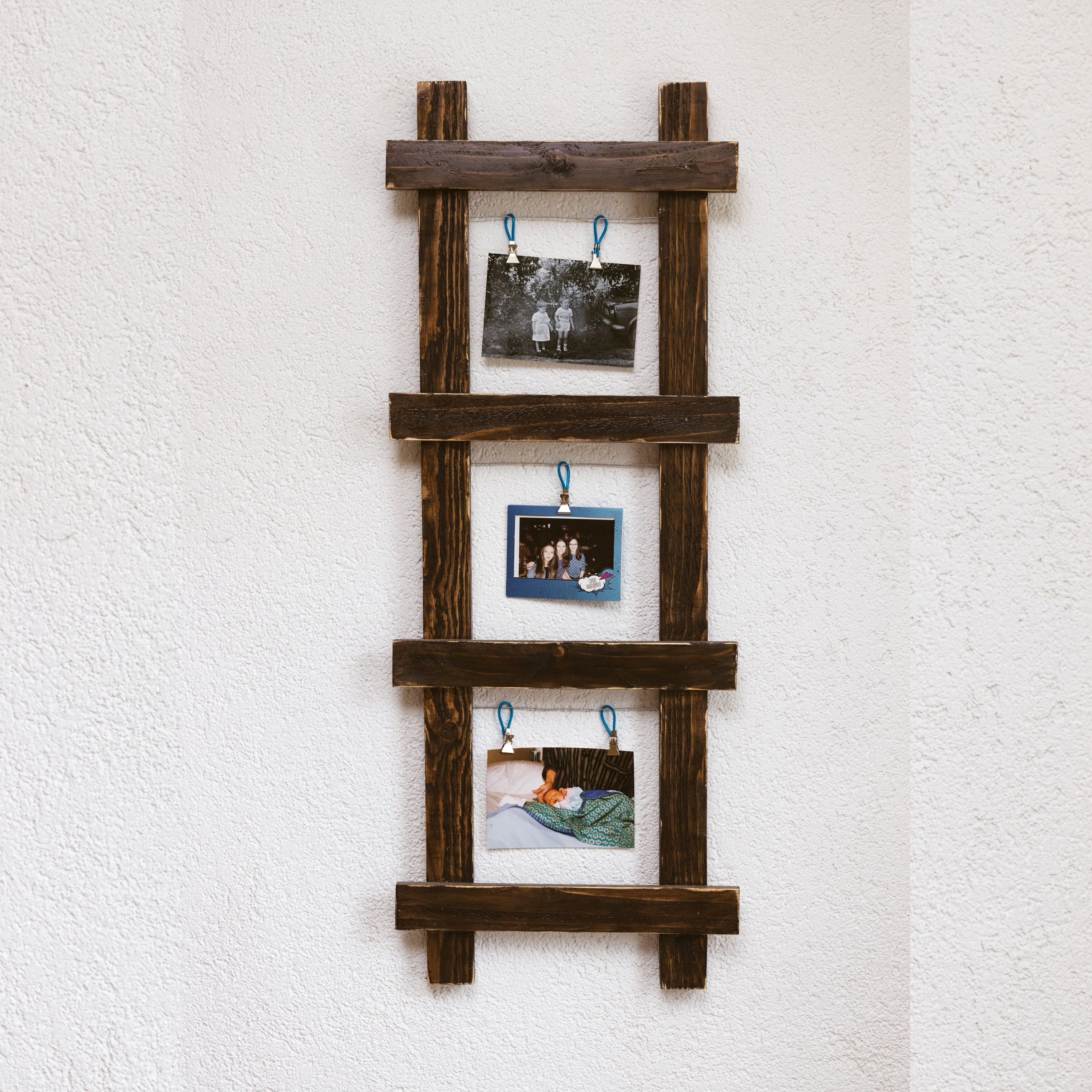 wooden ladder photo display with frames