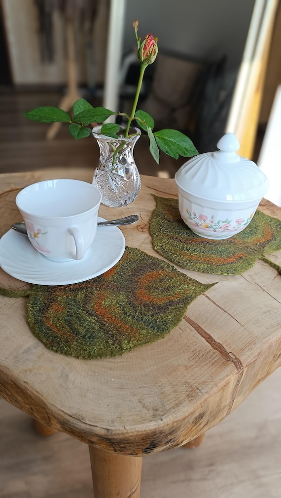 felt leaf coasters on wooden table