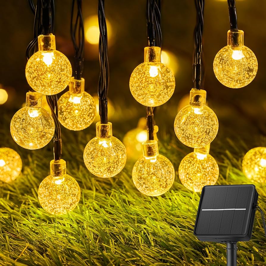 solar string lights draped over garden pergola