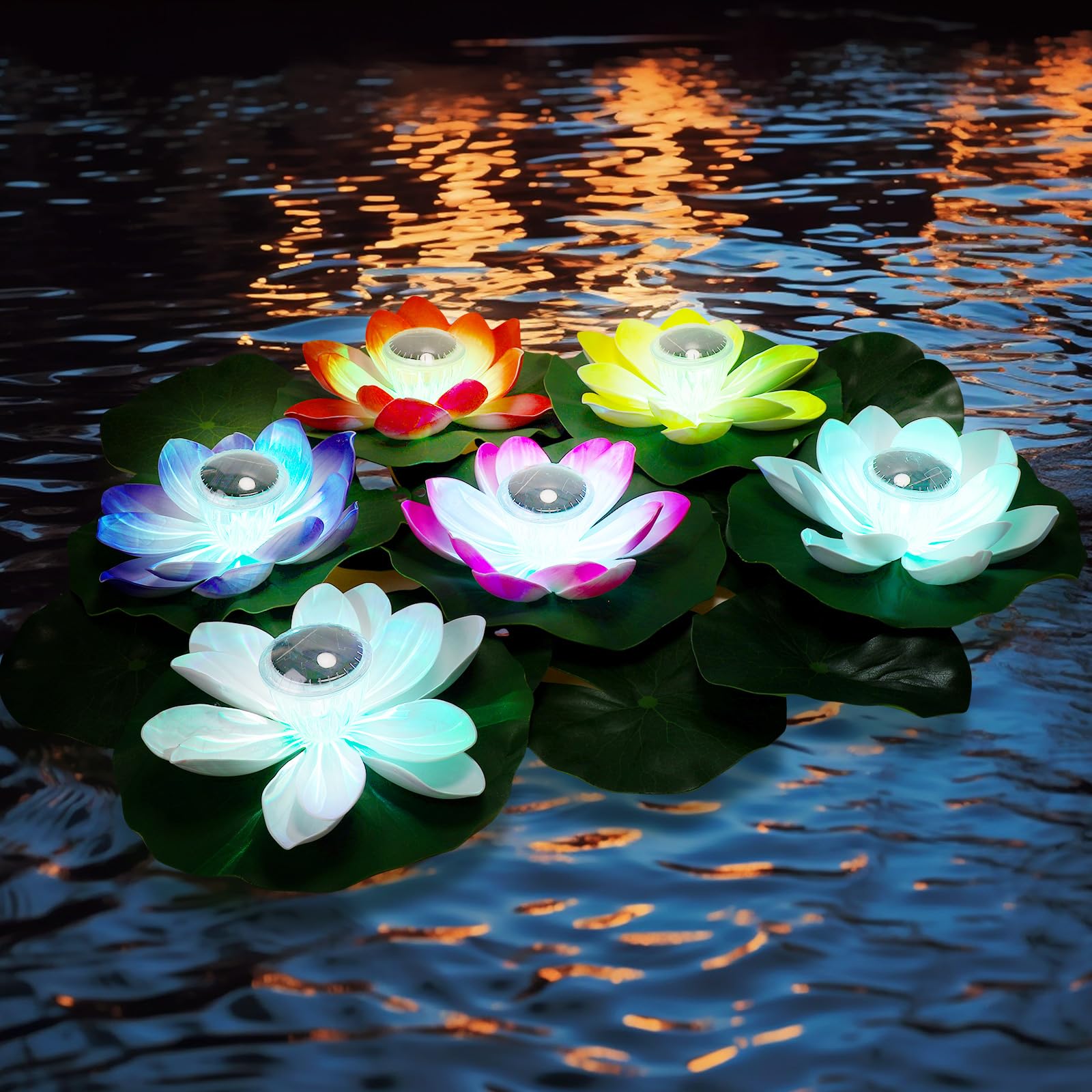 solar floating lights on backyard pond at night