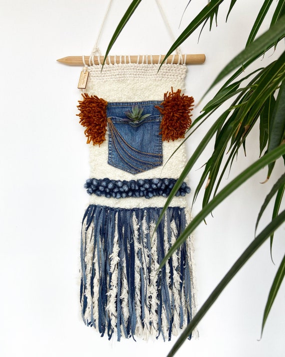 denim wall hanging in room
