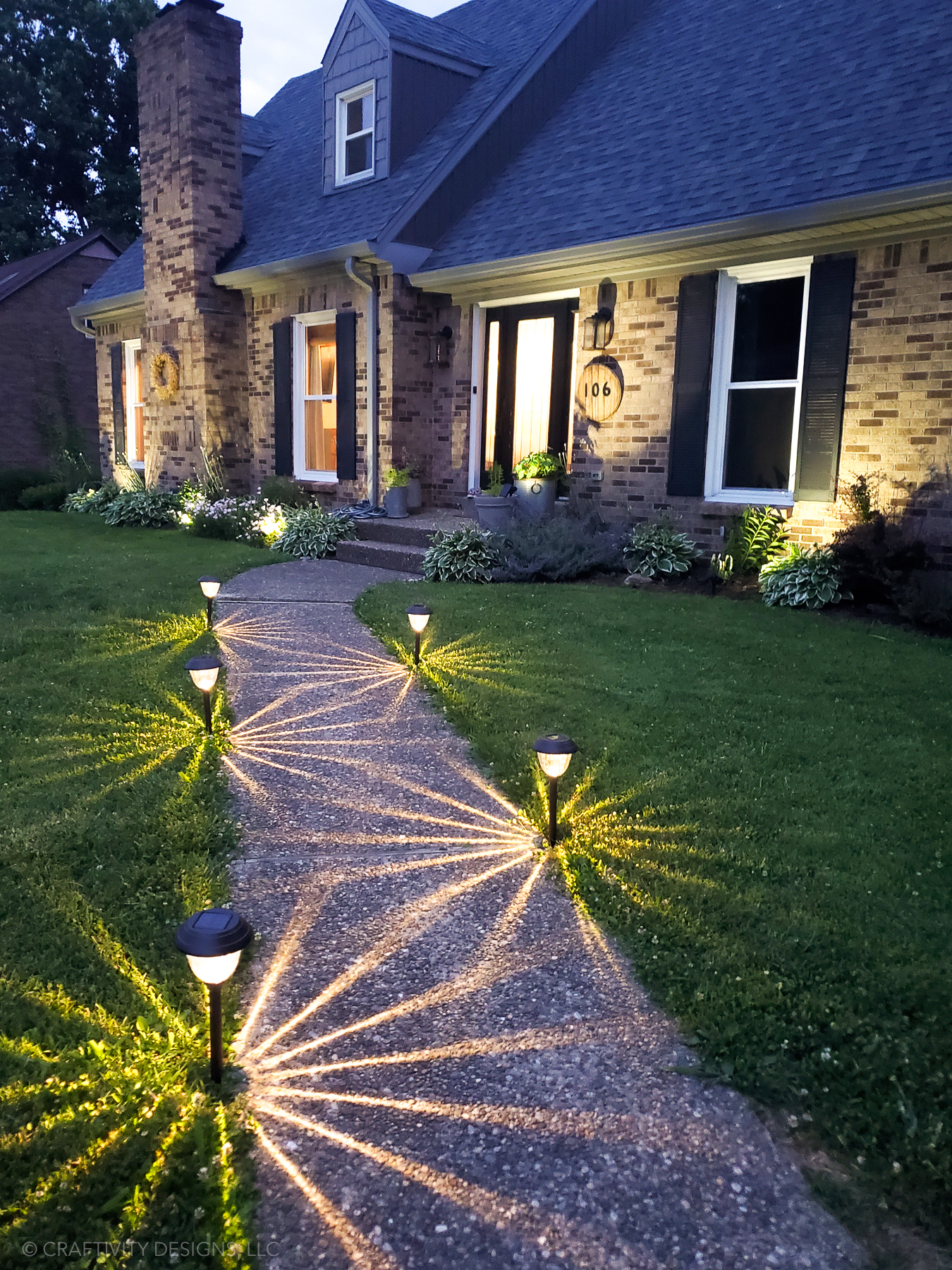 solar lanterns lining stone path outdoor backyard lighting