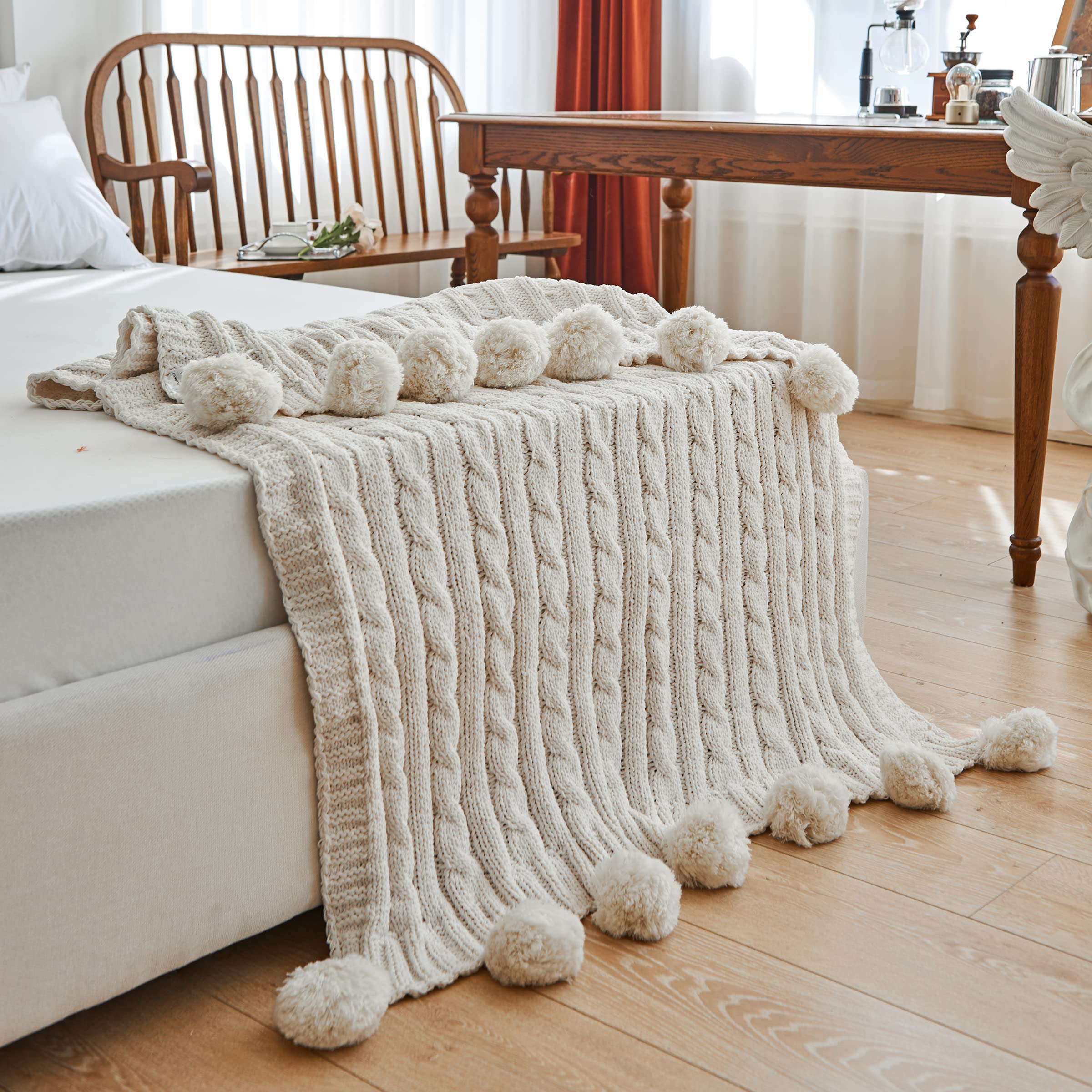 knit throw blanket with pom poms